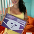 Woman holding a ZAQ skincare product box in a casual setting