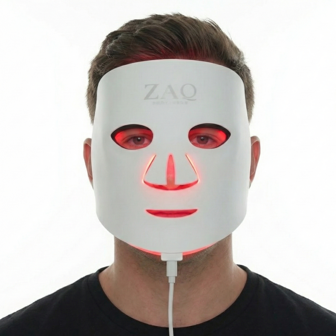 Person wearing a white LED face mask with visible branding on a white background