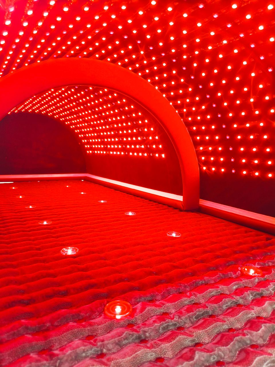 Red LED light tunnel with a textured floor