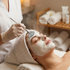 Woman receiving a facial treatment in a spa setting