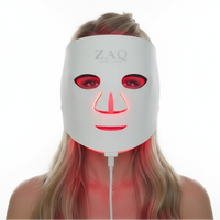 Person wearing a ZAQ LED face mask on a white background