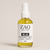Bottle of ZAQ Skin Care Relax Purifying Bath + Body Oil on a beige background