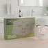 ZAQ Noor 2.0 Pro LED face mask shown with its green and white retail box on a bathroom counter, with the mask illuminated on the right.