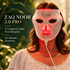 A woman wearing a ZAQ NOOR 2.0 PRO LED skincare mask that glows red, with text overlays on the left detailing its features, set against a soft-focus green background.