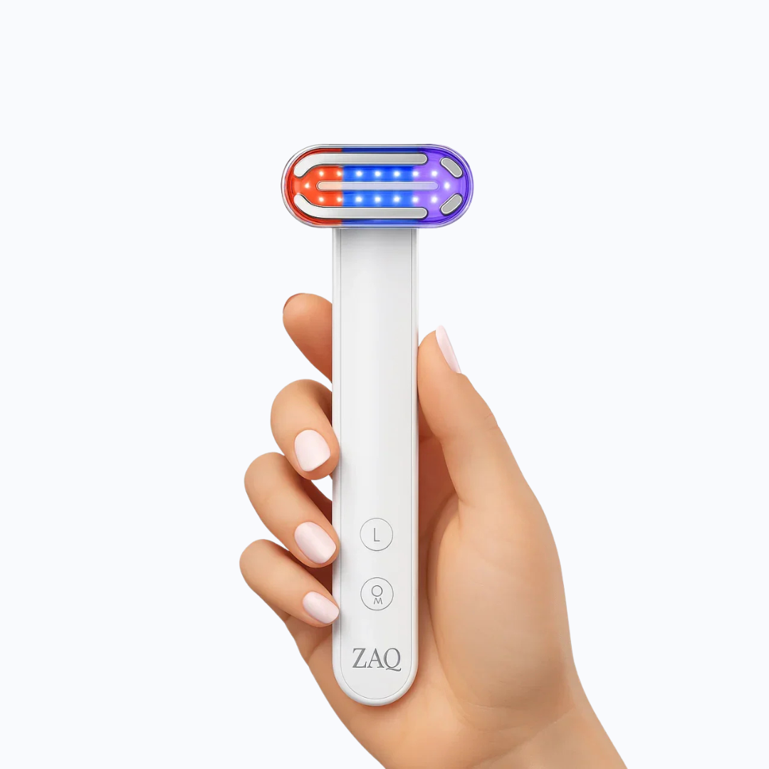 Hand holding a ZAQ Zayn Wand device on a white background